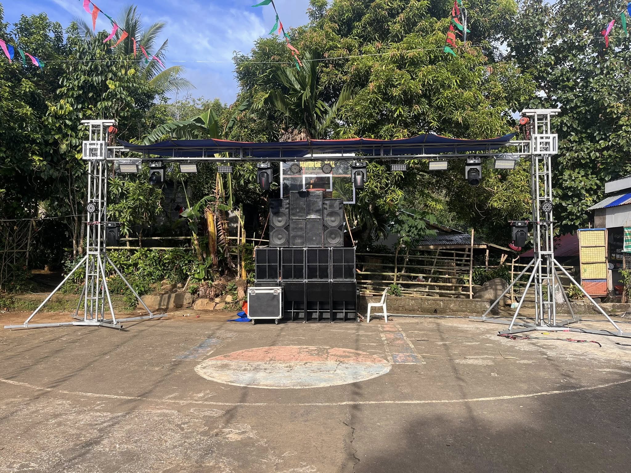 Full truss and sound system setup at an outdoor fiesta